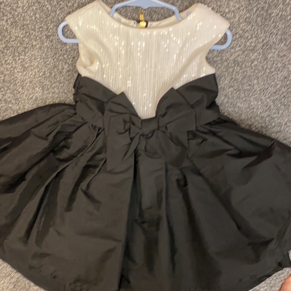 White Sequins and high low black dress with bow